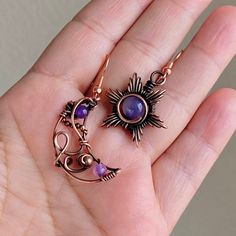 This Cute mismatched sun and moon with genuine natural  round Amethyst is lightweight earrings wire wrapped free style in solid copper, handcrafted patina, sanded,  hand polished and sealed with a protective layer so that the copper preserves the details of the patina. This item is gift wrapped in a box with a delicate presentation  and organza bag :) ▪︎Moon height: 1.5 " included hook  ▪︎Sun height:1.50" ▪︎Same/next day free US shipping- first class with tracking. ▪︎if you have any questions pl Handmade Purple Celestial Earrings, Handmade Moon Shaped Amethyst Jewelry, Moon Shaped Wire Wrapped Earrings Gift, Handmade Purple Moon-shaped Jewelry, Adjustable Mystical Wire Wrapped Earrings, Earrings Sun And Moon, Sun And Moon Jewelry, Wire Wrapped Moon, Purple Amethyst Earrings