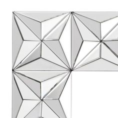 an image of a mirror that looks like it has been cut into squares and triangles