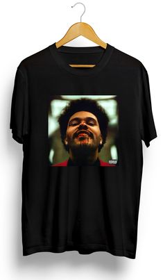 a black t - shirt with a man's face on it