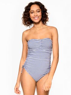 A bold gingham print makes this Sun Ocean Sand one-piece swimsuit an instant favorite. Crafted with a playful tie front and adjustable straps for extra support. The perfect pool or beach day essential. Features One Piece Lined Soft Cup Adjustable & Removable Straps Sun Ocean Sand Imported Material: Body: 85% Nylon, 15% Spandex; Lining: 92% Polyester, 8% Spandex Care: Hand Wash Cold; Do Not Wring Or Twist; Only Non-Chlorine Bleach When Needed; Line Dry; Do Not Iron; Do Not Dry Clean | Sun Ocean S Gingham Swimwear For Sunbathing, Gingham Swimwear For Beach Season Sunbathing, Gingham Swimwear For Sunbathing In Beach Season, Gingham Swimwear For Sunbathing In Spring, Spring Gingham Swimwear For Sunbathing, Gingham Swimwear For Poolside And Beach Season, Fitted Gingham Swimwear For Sunbathing, Summer Gingham Swimwear For Pool, Gingham Swimwear For Beach Season