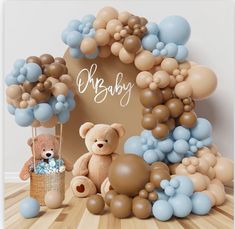 there is a teddy bear and balloons in front of the baby's photo frame