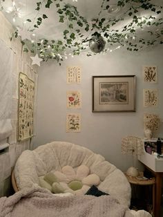 a bedroom with lots of plants growing on the ceiling and lights hanging from the ceiling