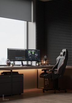 a desk with two computer monitors and a chair in front of the monitor on it