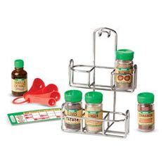 an assortment of spices and condiments are arranged in a pyramid on a white background