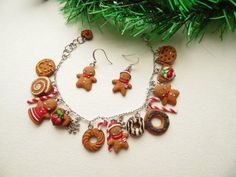 a christmas necklace and earring set with gingerbread cookies, candy canes, candies