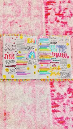 the inside pages of a planner spread out on a pink background with lots of colorful writing