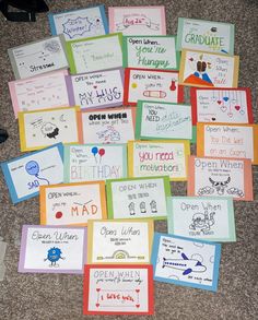 many greeting cards are laid out on the floor to be used for someone's birthday