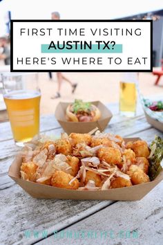 some food is sitting on a picnic table with beer and people in the background text reads first time visiting austin tx here's where to eat