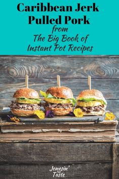 three sandwiches sitting on top of a wooden table with the title, carib bean jack pulled pork from the big book of instant pot recipes