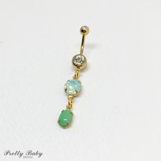 "Gold MINT GREEN OPAL Dangle Belly Ring - opal belly ring, seafoam green crystal navel piercing, long Ab iridescent, bellybutton vintage Pretty belly ring in surgical steel colored gold With a gem in clear With vintage glass glass crystal dangles in opalescent mint celadon seafoam green, and matte light green crystals. Made with vintage glass stones from Austria and Germany, and hand set into new prong brass settings. entire piece approx 2\" long.  14 gauge Externally threaded. Large barbell rhinestone approx 7mm across Comes in an organza gift bag To keep the rhinestones looking their best I recommend you do not wear this piece while swimming or bathing.  NOT RECOMMENDED FOR THOSE WITH SENSITIVE SKIN, METAL ALLERGIES, OR NEW PIERCINGS I DO NOT OFFER RETURNS or EXCHANGES, so please select Adjustable Green Belly Rings As Gift, Belly Button Rings Emerald, Green Belly Button Rings, Opal Belly Button Piercing, Elegant Nickel-free Belly Rings, Light Green Crystals, Cheap Nickel-free Dangle Belly Rings, Opal Belly Ring, Dangle Belly Rings