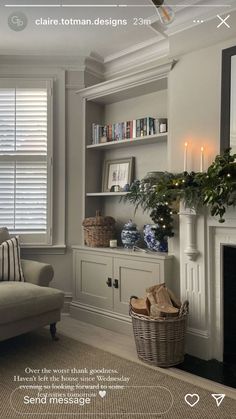 a living room filled with furniture and a fire place in front of a book shelf