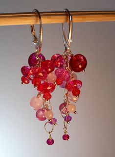 "\"Cherished cherries!\" earrings. What a juicy gemstone the tourmaline is! Transparent, delicate, full of rich color from pink to red! Tangled with pink quartz, amethyst, agate and alexandrite beads hang together from a sterling silver chain, creating a sparkle bunch.  Sterling silver hooks and pins.  Handmade. Length: 6,5cm You will receive them in a gift package." Pink Briolette Sterling Silver Earrings, Pink Sterling Silver Briolette Earrings, Pink Briolette Earrings With Natural Stones, Pink Briolette Natural Stone Earrings, Pink Gemstone Earrings For Valentine's Day, Unique Pink Ruby Jewelry, Pink Briolette Ruby Jewelry, Unique Pink Gemstone Earrings, Unique Pink Sterling Silver Earrings