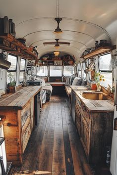 the inside of an rv with wood flooring and wooden counter tops on both sides