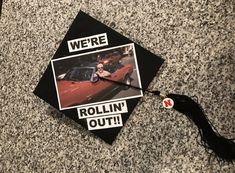 a graduation cap with the words we're rollin'out on it