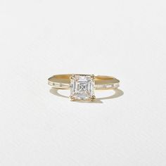 an engagement ring with a princess cut diamond