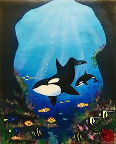 an underwater scene with two orca's and fish