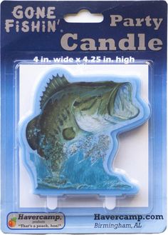 a fish shaped candle holder in the packaging