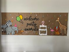 a welcome party banner with animals, giraffes and a cake on it