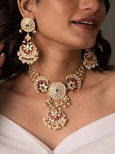 This Sabyasachi Inspired Set is as seen in many Bollywood Shows, this is exquisite piece of Jadau Kundan Necklace is made of silver based handcrafted kundan pieces that are heritage of Indian Jewelry. As seen in many Bollywood Shows, this is exquisite piece of Jadau Kundan Necklace is made of silver based handcrafted kundan pieces that are heritage of Indian Jewelry. The Necklace Has Adjustable Dori . The Earrings Have pushbacks.  Customized orders takes 3 to 4 weeks, depending on piece requirements. The Ombre Designs Jewelry pieces can be customized in accordance with your requirement. Please Email or Whats app on : +91 8448833193 / sonalikamehra [!at] theombredesigns.com Traditional Chandbali Necklace With Jewels, Festive Chandbali Shaped Necklace, Festive Chandbali Necklace, Cutdana Necklaces For Receptions, Silver Kundan Necklace With Jewels For Festivals, Traditional Round Kundan Necklace With Jewels, Silver Chandbali Necklaces For Formal Occasions, Silver Chandbali Necklace For Formal Occasions, Traditional Round Bridal Necklace With Jewels