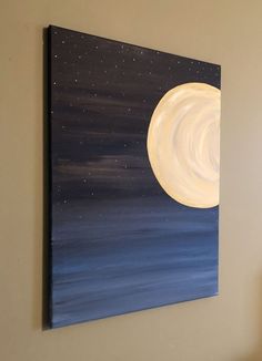 a painting hanging on the wall above a bed with a night sky and stars painted on it