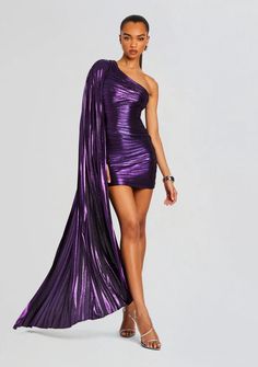 The Karena Dress is the epitome of sophistication and glamour, featuring a shoulder drape and a flattering silhouette. Crafted with stunning lamé material, it's your go-to choice for any formal event. Shown here in Cosmic Stardust. 95% Polyester, 5% Spandex Made in China Model is 5'10" wearing size XS Style No. SS24-87 Elegant One-shoulder Metallic Dress, Glamorous Draped One Shoulder Dress, Metallic Draped Dress For Night Out, Glamorous Draped One-shoulder Dress For Formal Occasions, Glamorous Draped One Shoulder Dress For Formal Events, Metallic Fitted Draped Dress, Metallic Draped Fitted Dress, Glamorous Draped One Shoulder Dress For Formal Occasions, Glamorous Draped One-shoulder Dress