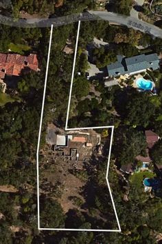 an aerial view of the house and surrounding trees