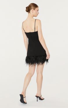 Show off your flattering silhouette in our Cora Dress. Featuring a black fit and flare silhouette with a v-neckline and bow detail, and a mini skirt with a feather hem. Be ready to make a statement in this stunning piece. Fit Details V necklineLinedFit and flare silhouetteMini lengthSleeveless67% Polyester 27% Rayon 6% SpandexDry Clean Only Made in USA Length: 23.5in/59.69cm, from strap seamMeasurements from size 4 Feathered Mini Dress For Night Out, Elegant Mini Dress With Feathers, Mini Dress With Feather Trim For Gala, Mini Length Feather Trim Dress For Gala, Feathered Mini Dress For Date Night, Evening Mini Dress With Feather Trim, Mini Gala Dress With Feather Trim, Mini Gala Dresses With Feather Trim, Flirty Mini Dress With Feathers