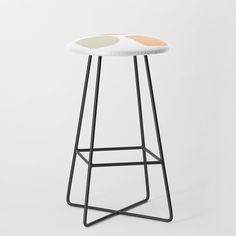 a stool with a blue and white design on the seat is against a white background