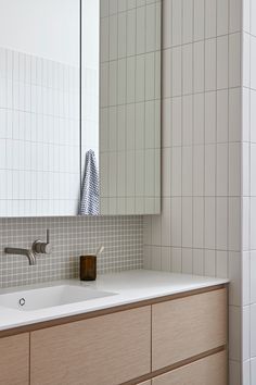 a bathroom with two sinks and mirrors in it