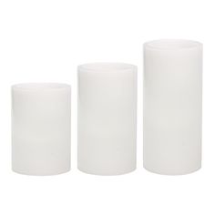 three white vases sitting next to each other