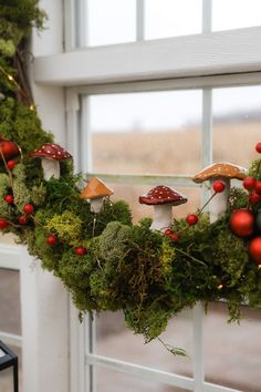 a wreath made out of moss and mushrooms