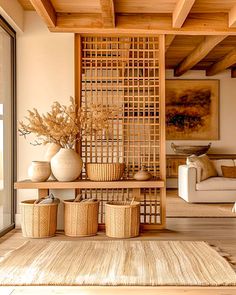 a living room filled with lots of furniture and vases on top of a table