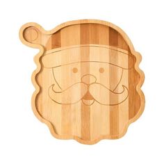 a wooden cutting board with an image of a santa claus face on the front and side