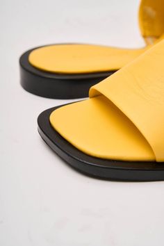 Heel height 0.8in Genuine Leather Lining - Genuine Leather Introducing the Alo Flop Flops, a vibrant and stylish addition to your summer wardrobe, proudly crafted by Fabio Monelli in Turkey using premium, natural leather. These flip-flops combine comfort and fashion effortlessly, making them an essential choice for any casual occasion. Trendy Yellow Leather Sandals, Yellow Summer Slides With Rubber Sole, Yellow Rubber Sole Slides For Summer, Yellow Slides With Rubber Sole For Summer, Summer Leather Flip Flops With Textured Footbed, Trendy Leather Flip Flops With Textured Footbed, Yellow Sandals For Summer, Summer Leather Flip Flops With Flat Heel, Summer Leather Slide Mules