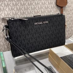 Michael Kors Jet Set Travel Large Double-Zip Wristlet-Wallet-Phoneholder Black Nwt Authentic Michael Kors Crafted From Signature-Print Canvas. This Graphic Wallet Has Two Zip Sides That Unfold To Reveal A Center With Pockets For All The Essentialsfrom Credit Cards To Your Smartphone. A Detachable Wristlet Strap Makes It Versatile Enough To Carry Alone Or In A Tote. Details Smartphone Wallet Logo-Print Canvas/Faux Leather 89.4% Coated Canvas/9.6% Polyester/1% Polyurethane Trim: 60% Polyurethane/2 Black Michael Kors Wallet, Baby Ferrets, High End Handbags, Mk Wallet, Luxury Bags Collection, Michael Kors Wristlet, Exterior Details, Envelope Wallet, Black Leather Wallet