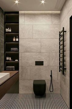 a modern bathroom with black and white checkered flooring, dark wood cabinets and shelving