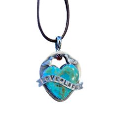 "Love Life", this limited edition necklace is truly a one of a kind every time its made. The stones are all hand selected and extremely organic. Centerpiece measures approximately 1" wide by 1.5" high and comes on an 18" deer suede necklace. Suede Necklace, Magical Jewelry, Love Life, Deer, Limited Edition, Novelty Christmas, Personalized Items