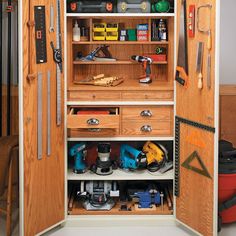 an open cabinet with tools inside of it