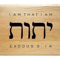 a wooden plaque with the words i am that i am and an image of two hebrew letters