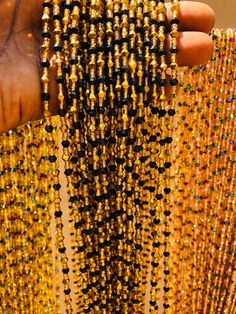 "❀ This Crystal listing is from 20 to 100 strands of waistbeads ❀ Beads Ship directly from Ghana ❀ Bead length is 47\"Note. Bead length cannot be made longer than 47inches. ❀ Regular Beads sizes vary from size 6/0 to 8/0, 11/0 to 8/0 ❀ DHL requires customer's phone number during shipment, please provide one ❀You will receive quality & gorgeous waistbeads not limited to the ones in the display pictures ❀ Beads are made with Cotton Strands to prevent any allergic reactions ❀ Shipping takes 3-5 Business days after processing(3-4 business days) ❀ Email me with any questions. I am usually quick at responding" Beaded Beads For Party And Festivals, Festive Gold Beaded Necklaces With Black Beads, Gold Beaded Necklaces For Festivals, Traditional Black Beaded Necklace For Party, Traditional Party Waist Beads, Oval Beads Beaded Necklaces For Party, Beaded Necklaces With Round Beads For Parties And Festivals, Traditional Beaded Chain Beads For Party, Gold Beads With Beaded Chain For Festivals