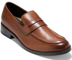 Elevate your formal look with these Cole Haan Grand+ Dress Penny Loafers in British Tan. These shoes feature a slip-on design with a solid pattern and are made from high-quality leather. The cushioned insole and comfortable fit make them perfect for long hours of wear. Available in size 13, they are the ideal choice for any stylish man looking to make a statement. The Cole Haan Grand+ Dress Penny Loafers come from the renowned Grand collection and offer unmatched quality and style. With a product line that speaks for itself, these dress shoes are perfect for any formal occasion. Don't miss out on the opportunity to own a pair of these timeless shoes. Brown Slip-ons For Spring Formal, Business Slip-ons With Moc Toe For Fall, Formal Wingtip Slip-ons For Spring, Spring Business Slip-ons With Moc Toe, Formal Moc Toe Slip-ons For Spring, Formal Spring Moc Toe Slip-ons, Grand Dress, Timeless Shoes, Stylish Man