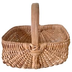 an empty wicker basket with a wooden handle