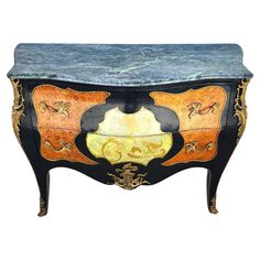 an ornately decorated chest with marble top