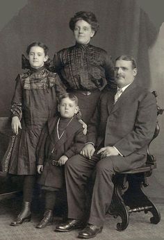 an old black and white photo of a family