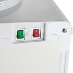 two red and green buttons on the side of a white refrigerator