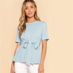 This fashion staple blouse is a MUST. Featuring a sash belted waist, 3/4 sleeves and a peep hole in the back. This top is perfect for in and out of the office. Pairs perfectly with slacks, jeans, skirts and leggings. Made with a polyester and spandex blend for comfort and style. Short Sleeve Tops For Women, Belt Blouse, Flowing Blouse, Peplum Tops, Pullover Women, Look Short, Summer Blouse, Elegant Blouses, Short Sleeve Tops