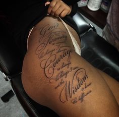 a woman sitting on top of a chair next to a hair dryer with writing on it