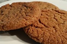 two cookies sitting on top of a white plate