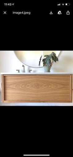 an image of a wooden cabinet with plants on top and the words in white above it