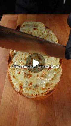 someone is cutting cheese on top of a pizza